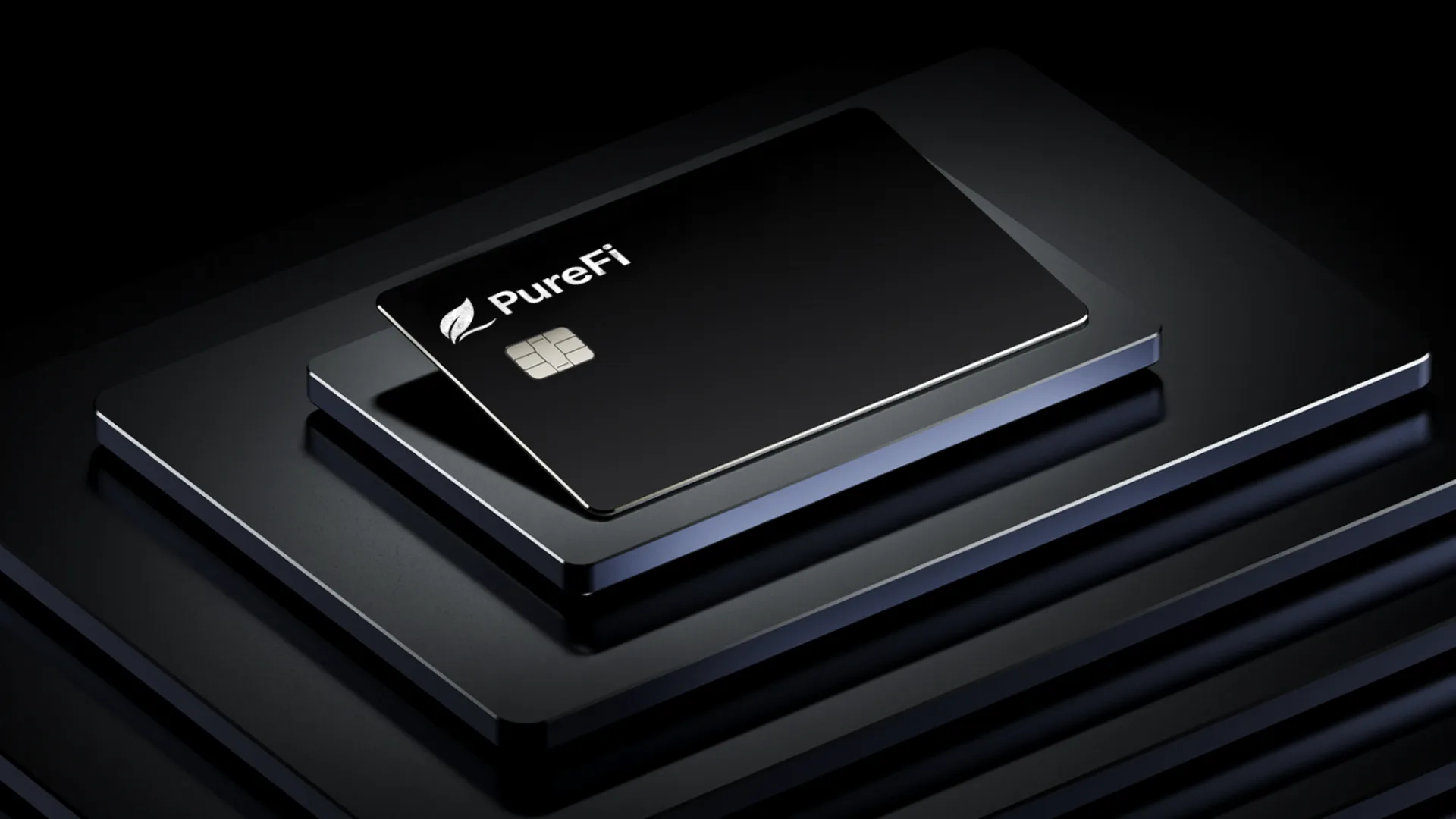 A close-up product shot of a PureFi card resting on a dark stepped platform under directional studio lighting
